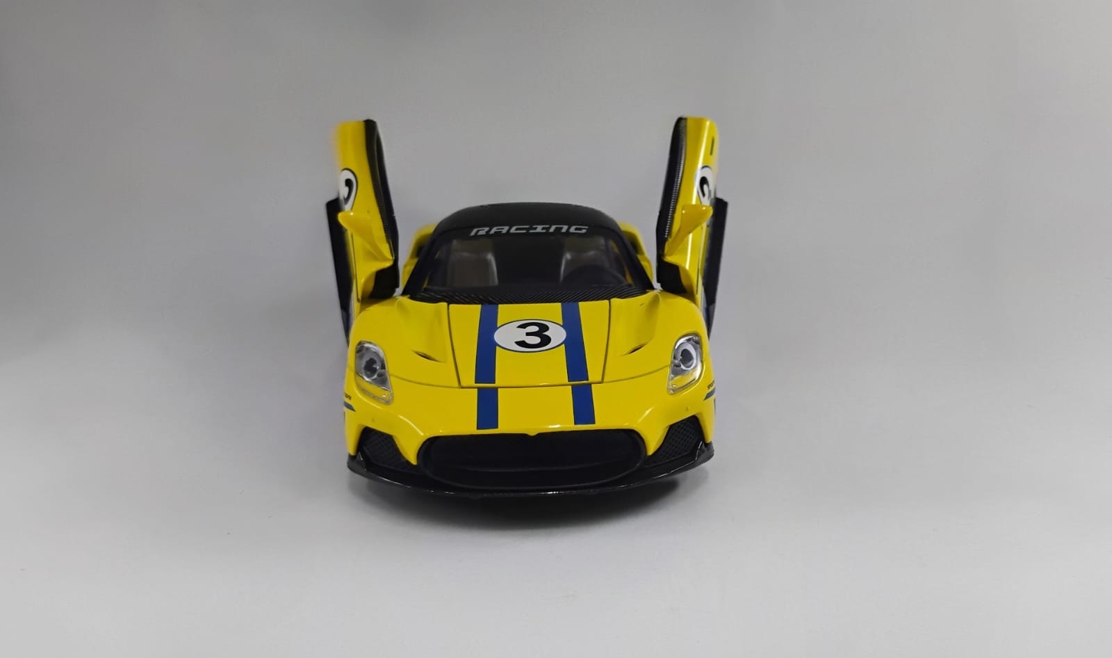Maserati MC20 in yellow 1.22 Die Cast 2 Maserati MC20 Die-Cast Model. 1:22 scale YELLOW WITH BLUE STRIPES - Image 1